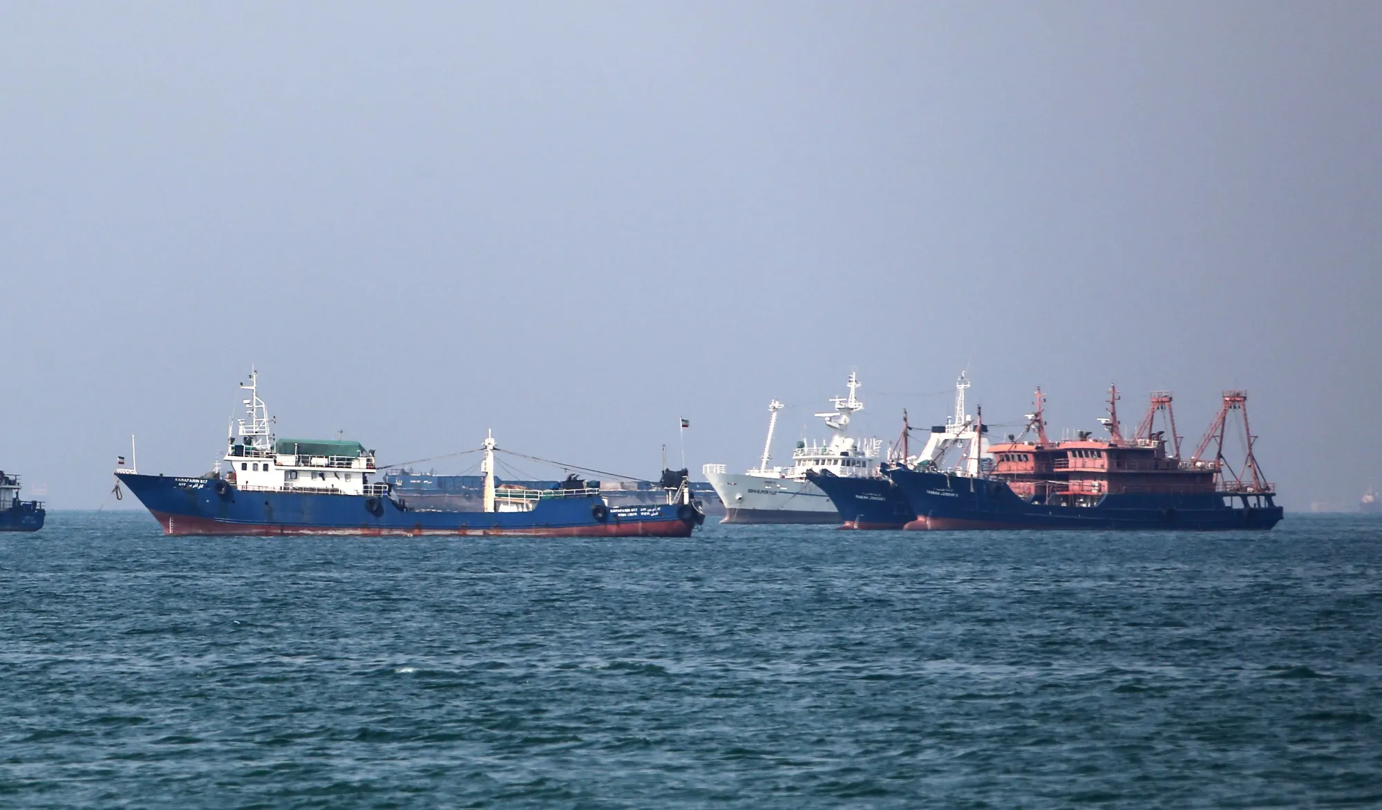 Oil tankers navigating the narrow Strait of Hormuz,