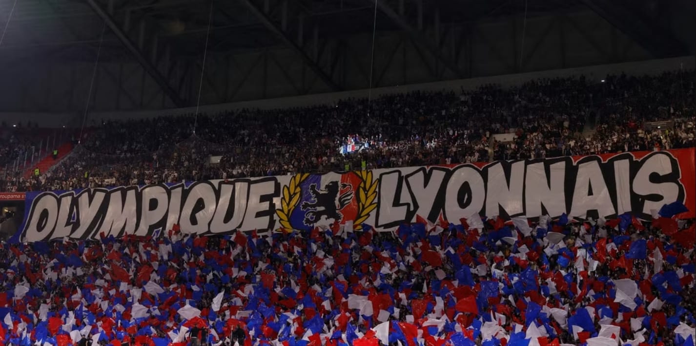 Olympique Lyon team crest with Ligue 2 logo—French football giants relegated due to financial crisis.