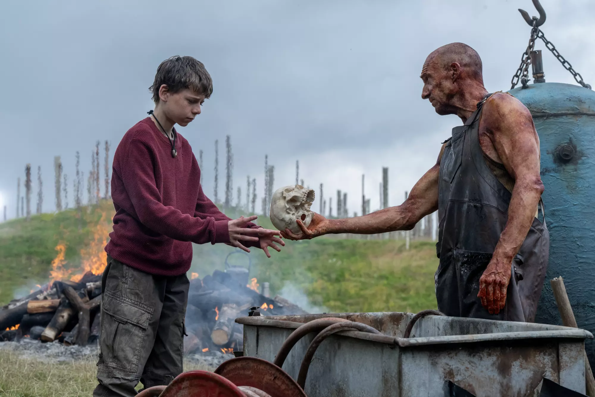 Ralph Fiennes, right, and Alfie Williams in the movie “28 Years Later.”(Miya Mizuno / Sony Pictures)