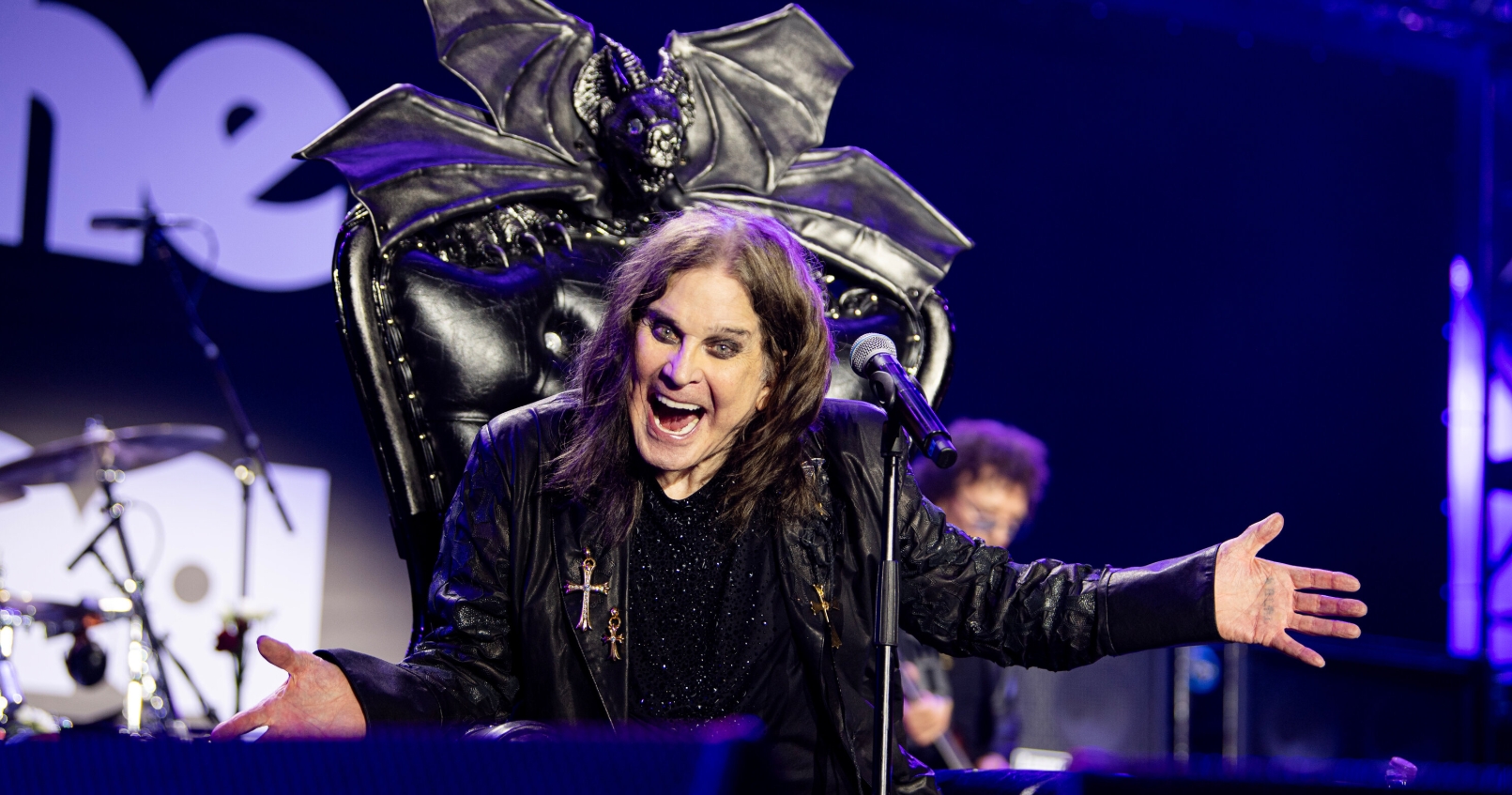 Ozzy Osbourne performing on stage in his final concert in Birmingham