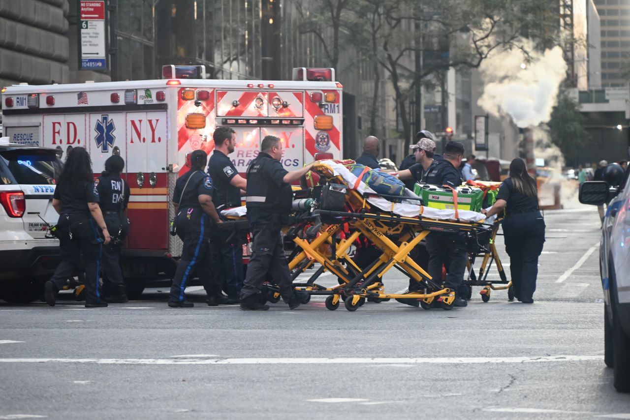NYPD officers secure the scene outside 345 Park Avenue following a mass shooting in Midtown Manhattan, July 28, 2025.